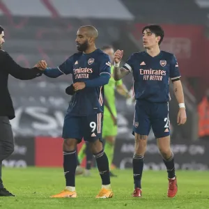 Arsenal's Arteta and Players Celebrate Win Against Southampton Amidst Empty St. Mary's Stadium (2020-21)