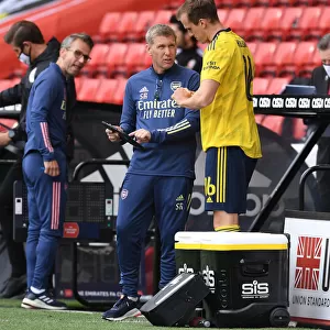Arsenal's Assistant Coach Steve Round Speaks to Rob Holding during FA Cup Quarterfinal vs Sheffield United