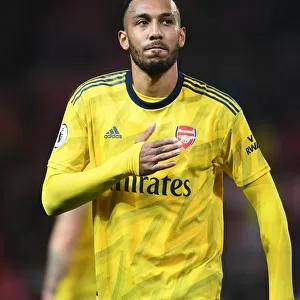 Arsenal's Aubameyang Celebrates Victory over Manchester United with Fans