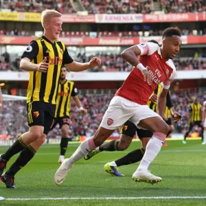 Arsenal's Aubameyang Clashes with Watford's Hughes in Premier League Showdown