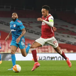 Arsenal's Aubameyang in Europa League Action: Emirates Stadium Showdown vs. Olympiacos Amidst Empty Seats (2020-21) Arsenal's Aubameyang in Europa League Action: Emirates Stadium Showdown vs. Olympiacos Amidst Empty Seats (2020-21)
