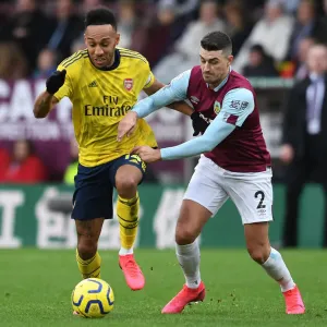 Arsenal's Aubameyang Faces Off Against Burnley's Lowton in Premier League Clash Arsenal's Aubameyang Faces Off Against Burnley's Lowton in Premier League Clash