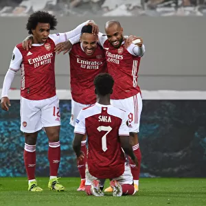 Arsenal's Aubameyang, Lacazette, and Saka Celebrate Goals Against SL Benfica in Europa League