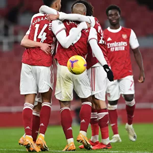Arsenal's Aubameyang and Lacazette Celebrate Goals Amidst Empty Emirates Stadium Against Newcastle United (2021)