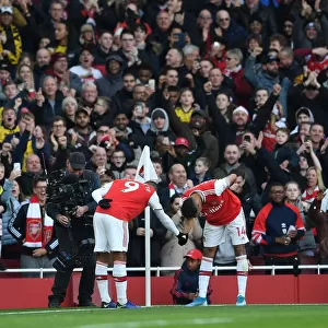 Arsenal's Aubameyang and Lacazette: Celebrating a Goal-Scoring Milestone Against Chelsea in the Premier League