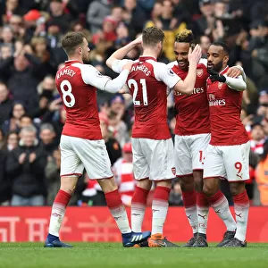 Arsenal's Aubameyang, Lacazette, Chambers, and Ramsey Celebrate Goals Against Stoke City