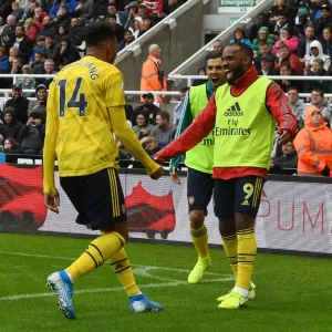 Arsenal's Aubameyang and Lacazette: Unstoppable Duo in Full Swing - Celebrating a Goal Against Newcastle United, 2019-20 Premier League Arsenal's Aubameyang and Lacazette: Unstoppable Duo in Full Swing - Celebrating a Goal Against Newcastle United, 2019-20 Premier League