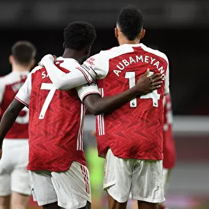 Arsenal's Aubameyang and Saka Celebrate First Goal in Empty Emirates Stadium Against Newcastle United (2021)