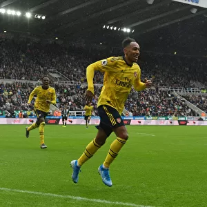 Arsenal's Aubameyang Scores St. James Park Stunner: Securing the Premier League Win over Newcastle United (2019-20)