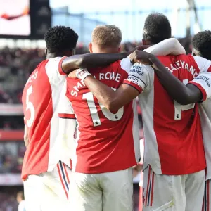 Arsenal's Aubameyang, Smith Rowe, and Saka Celebrate Goals Against Tottenham in 2021-22 Premier League Arsenal's Aubameyang, Smith Rowe, and Saka Celebrate Goals Against Tottenham in 2021-22 Premier League