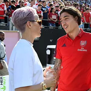 Arsenal's Bellerin Mingles with Megan Rapinoe of Reign FC during Arsenal v Fiorentina Match in Charlotte