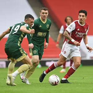Arsenal's Bellerin Outmaneuvers Sheffield United's Robinson in Premier League Clash