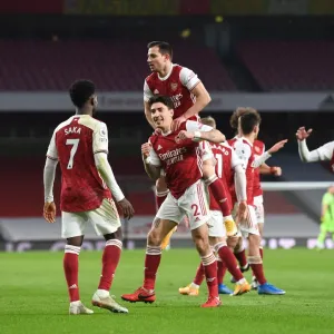 Arsenal's Bellerin, Saka, and Cedric: Celebrating a Triumphant Three-Goal Spree Against Leeds United in the Premier League, 2021 Arsenal's Bellerin, Saka, and Cedric: Celebrating a Triumphant Three-Goal Spree Against Leeds United in the Premier League, 2021
