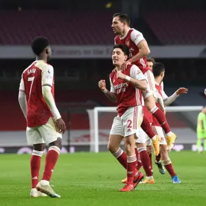 Arsenal's Bellerin, Saka, and Cedric Celebrate Goals Against Leeds United in 2021 Premier League Match Arsenal's Bellerin, Saka, and Cedric Celebrate Goals Against Leeds United in 2021 Premier League Match