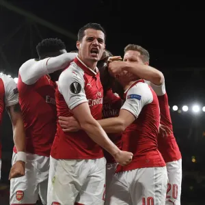 Arsenal's Bellerin and Xhaka Celebrate Goal Against Atletico Madrid in Europa League Semi-Final