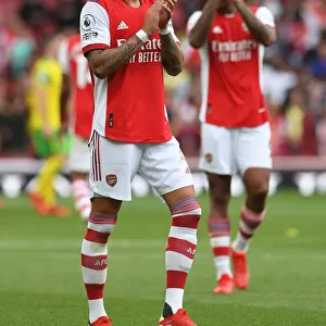 Arsenal's Ben White Celebrates with Fans: Triumph over Norwich City (2021-22)