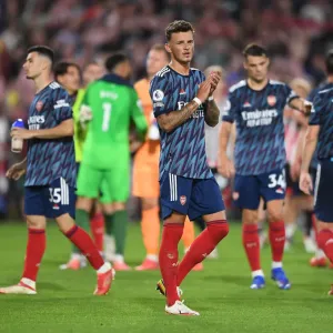 Arsenal's Ben White Celebrates with Fans: Brentford Victory in 2021-22 Premier League Arsenal's Ben White Celebrates with Fans: Brentford Victory in 2021-22 Premier League