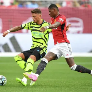 Arsenal's Ben White Outmaneuvers Manchester United's Marcus Rashford in Pre-Season Clash
