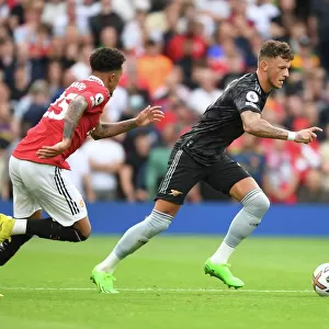 Arsenal's Ben White Outsmarts Jadon Sancho: A Premier League Victory for the Gunners (2022-23)