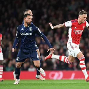 Arsenal's Ben White Overpowers Douglas Luiz: A Premier League Showdown at Emirates Stadium