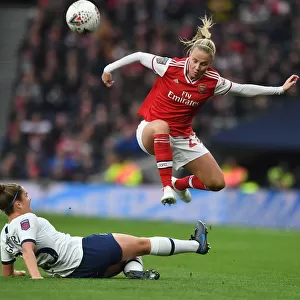 Arsenal's Beth Mead Skips Past Tottenham's Hannah Godfrey in FA WSL Clash