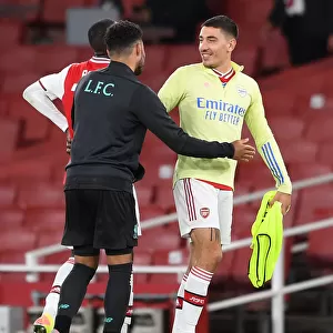 Arsenal's Bitter-Sweet Reunion: Hector Bellerin Embraces Oxlade-Chamberlain Amid Empty Emirates