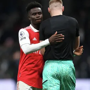 Arsenal's Bukayo Saka and Aaron Ramsdale Celebrate Victory over Tottenham Hotspur in 2022-23 Premier League Clash Arsenal's Bukayo Saka and Aaron Ramsdale Celebrate Victory over Tottenham Hotspur in 2022-23 Premier League Clash