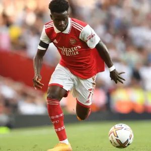 Arsenal's Bukayo Saka in Action against Fulham in 2022-23 Premier League Arsenal's Bukayo Saka in Action against Fulham in 2022-23 Premier League