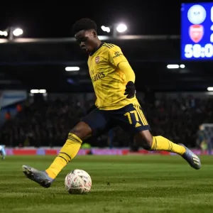 Arsenal's Bukayo Saka in Action: Portsmouth FA Cup Showdown Arsenal's Bukayo Saka in Action: Portsmouth FA Cup Showdown