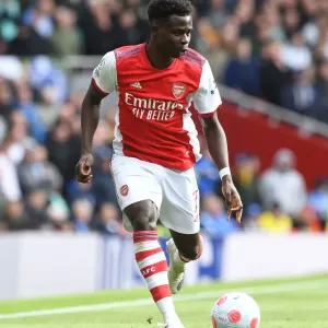 Arsenal's Bukayo Saka in Action: Premier League Clash Against Brighton & Hove Albion, 2021-22