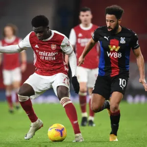 Arsenal's Bukayo Saka in Action: Premier League Clash Against Crystal Palace at Empty Emirates Stadium (2020-21)