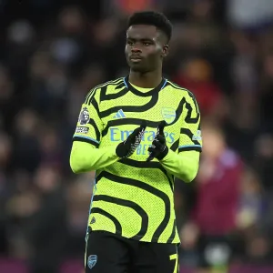 Arsenal's Bukayo Saka Celebrates with Fans after Aston Villa Victory (2023-24) Arsenal's Bukayo Saka Celebrates with Fans after Aston Villa Victory (2023-24)