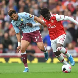 Arsenal's Bukayo Saka Clashes with Aston Villa's Trezeguet in Premier League Showdown