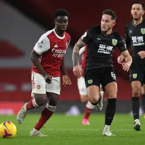 Arsenal's Bukayo Saka Clashes with Burnley's Josh Brownhill in Premier League Showdown