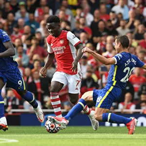 Arsenal's Bukayo Saka Clashes with Chelsea's Azpilicueta and Lukaku in Premier League Showdown