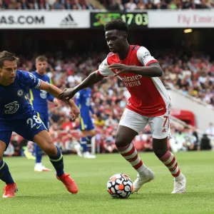 Arsenal's Bukayo Saka Clashes with Chelsea's Cesar Azpilicueta in the 2021-22 Premier League Match