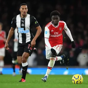 Arsenal's Bukayo Saka Clashes with Newcastle's Isaac Hayden in Premier League Showdown Arsenal's Bukayo Saka Clashes with Newcastle's Isaac Hayden in Premier League Showdown