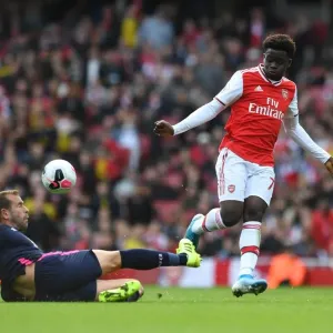 Arsenal's Bukayo Saka Faces Off Against Bournemouth's Steve Cook in Premier League Clash Arsenal's Bukayo Saka Faces Off Against Bournemouth's Steve Cook in Premier League Clash