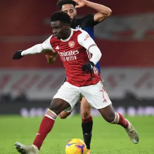 Arsenal's Bukayo Saka Faces Off Against Crystal Palace's Andros Townsend in Empty Emirates Stadium - Premier League Clash, January 2021