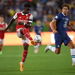 Arsenal's Bukayo Saka Fends Off Chelsea's Marcos Alonso in Florida Cup Clash