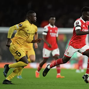 Arsenal's Bukayo Saka Goes Head-to-Head with Brice Wenbangomo in Europa League Showdown