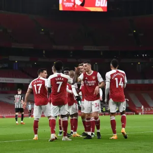 Arsenal's Bukayo Saka and Granit Xhaka Celebrate Goals Amidst Empty Emirates Stadium Against Newcastle United (January 18, 2021)