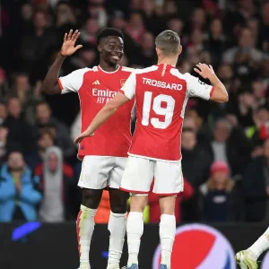 Arsenal's Bukayo Saka and Leandro Trossard Celebrate Goals Against Sevilla in 2023-24 UEFA Champions League