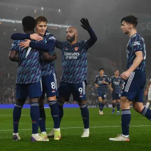 Arsenal's Bukayo Saka, Martin Odegaard, Alex Lacazette, and Kieran Tierney Celebrate Goals Against Leeds United in Premier League (December 2021) Arsenal's Bukayo Saka, Martin Odegaard, Alex Lacazette, and Kieran Tierney Celebrate Goals Against Leeds United in Premier League (December 2021)