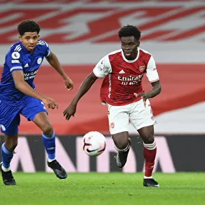 Arsenal's Bukayo Saka Outwits Leicester's James Justin in Empty Emirates Stadium