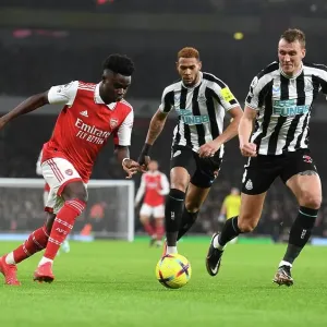 Arsenal's Bukayo Saka Outwits Newcastle's Dan Burn: A Premier League Tactical Battle