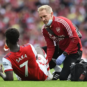 Arsenal's Bukayo Saka Receives Treatment from Physio during Arsenal v Norwich City Match, 2021-22 Season