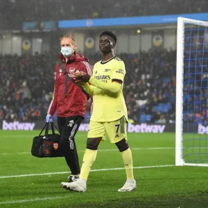 Arsenal's Bukayo Saka Receives Treatment from Physio during Brighton Match