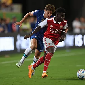 Arsenal's Bukayo Saka Takes on Chelsea's Marcos Alonso in the Florida Cup Clash