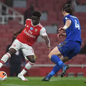 Arsenal's Bukayo Saka Tangles with Leicester's Caglar Soyuncu in Premier League Clash